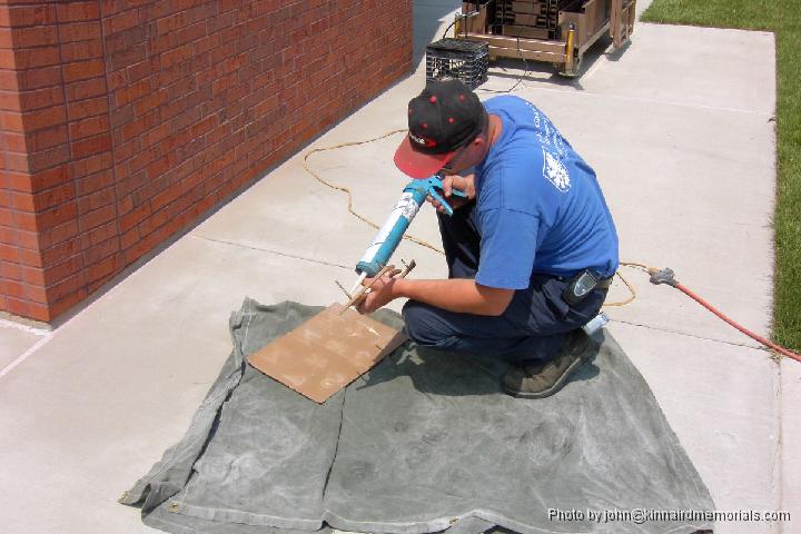 2002-05-17__PDRM3007.JPG - Each pin a coated in adhesive before being placed on the wall.